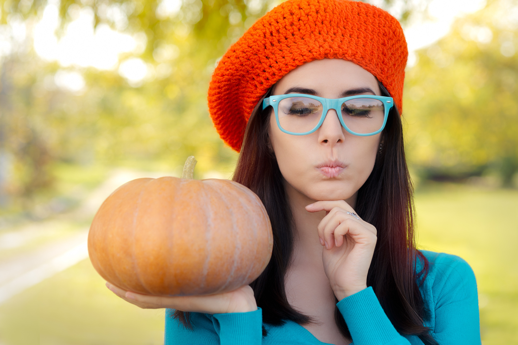Funny Woman Wearing Glasses Holding Pumpkin