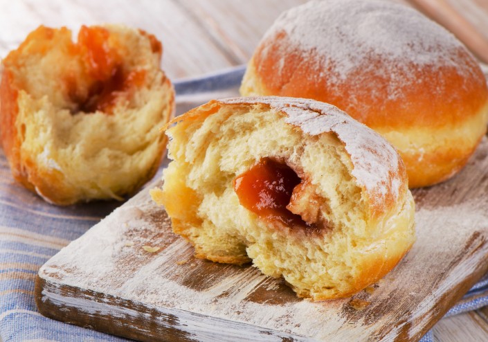 Sweet homemade donuts on wooden Table.