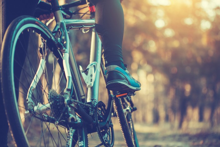 cyclist riding mountain bike in the forest