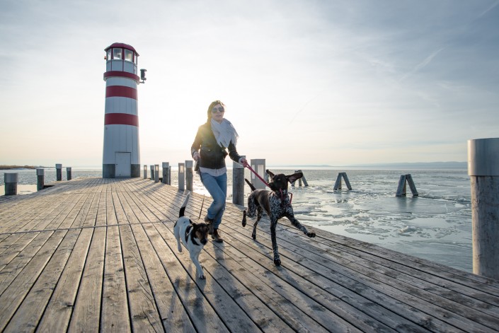 Active lifestyle woman running with two dog outdoor