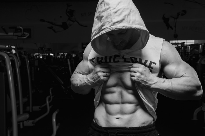 Male fitness model showing sixpack abdominal