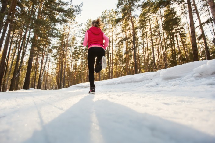 The girl running in winter Park