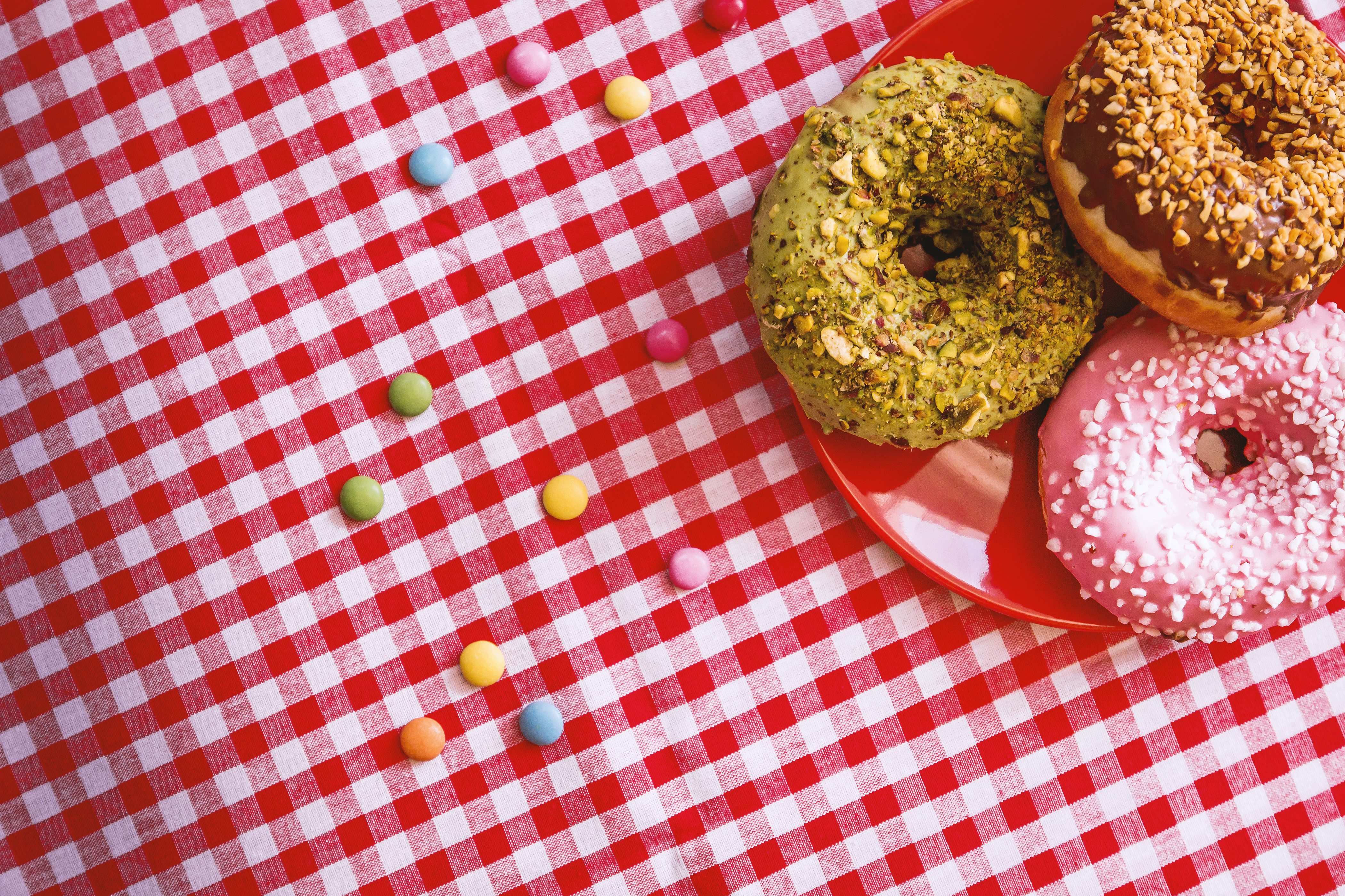 American Donuts on a plate on a nice checkered tablecloth