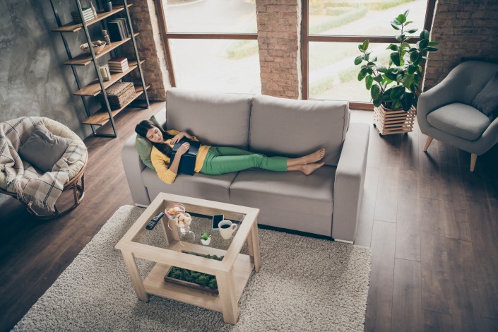 All night reading concept. Top above high angle photo of peaceful girl lie bare foot on divan sleep with paper book encyclopedia in house interior indoors