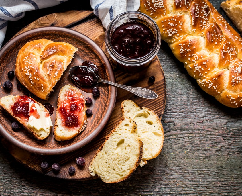 Challah is a Jewish bread to feast on wooden boards
