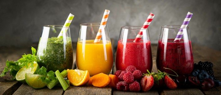 Selection of colorful smoothies in glasses