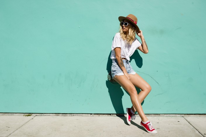 fashionista girl standing in the backstreet.