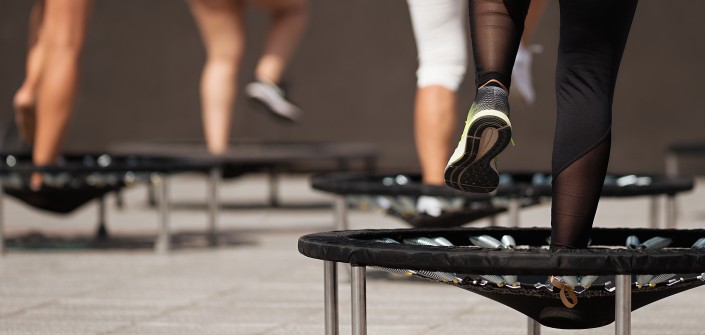 Fitness women jumping on small trampolines,exercise on rebounder