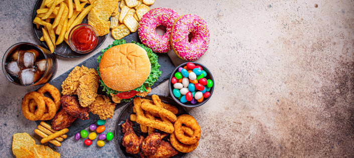 Bunner of fast food assortment. Junk food concept. Unhealthy food for the heart, teeth, skin, figure, top view.